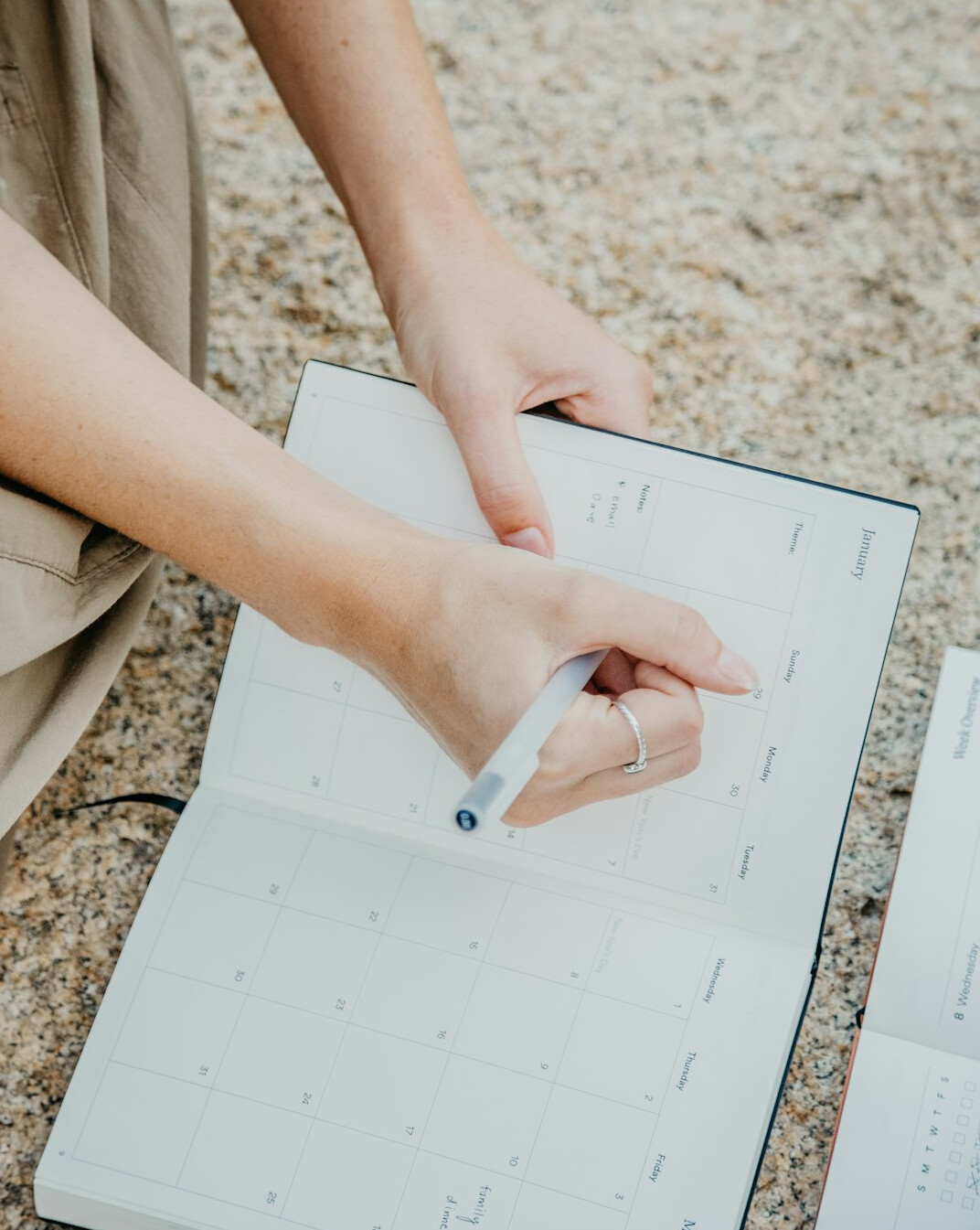 woman planning schedule on notebook
