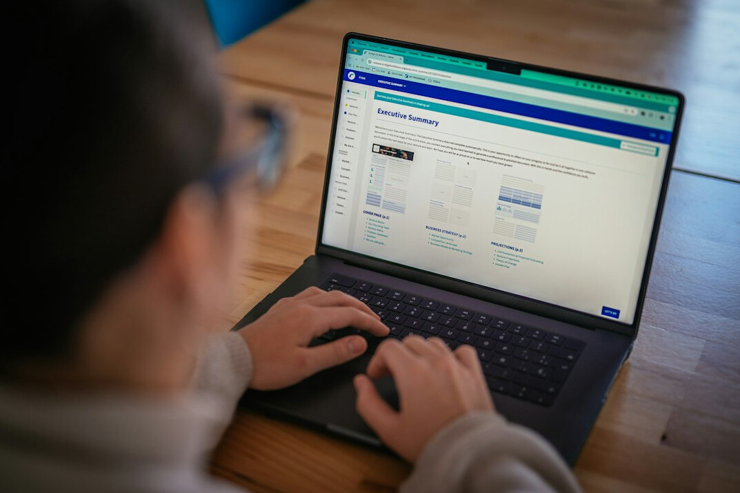 person analyzing data on laptop